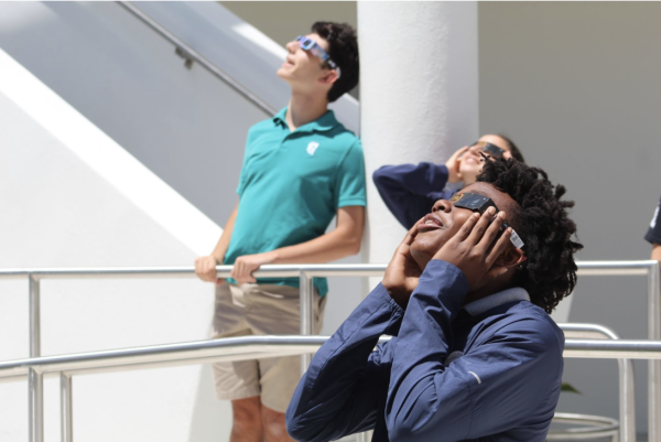 Freshman Deandre Leonard views the eclipse. Deandre was with his advisory class during the early part of the eclipse. 